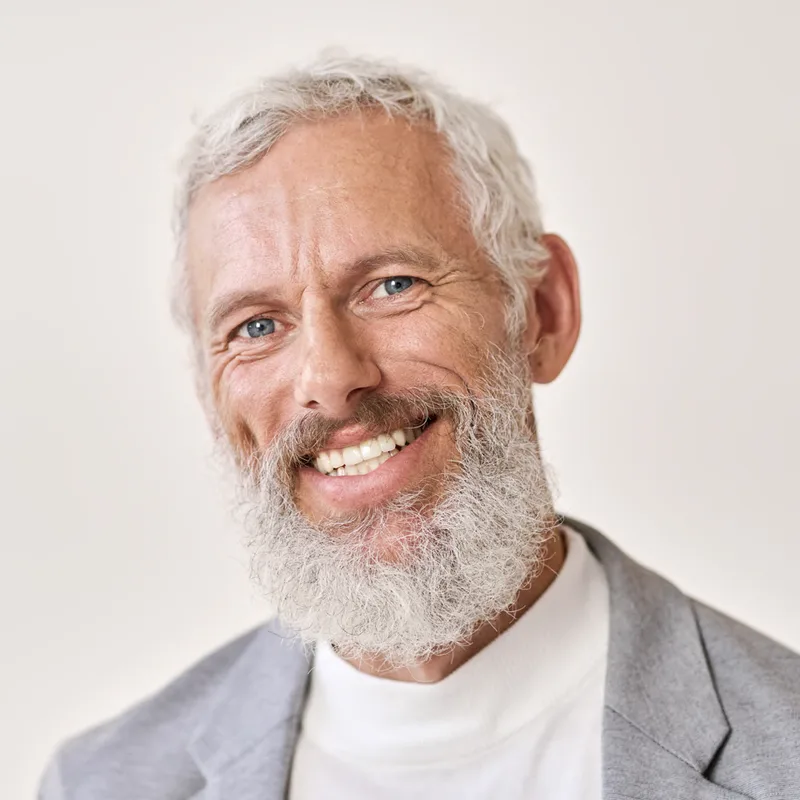 Smiling older man with a white beard