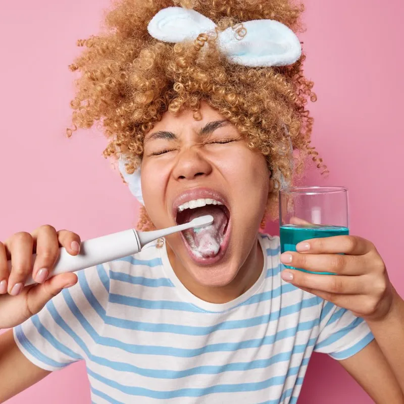 Example to avoid: child grimacing while brushing